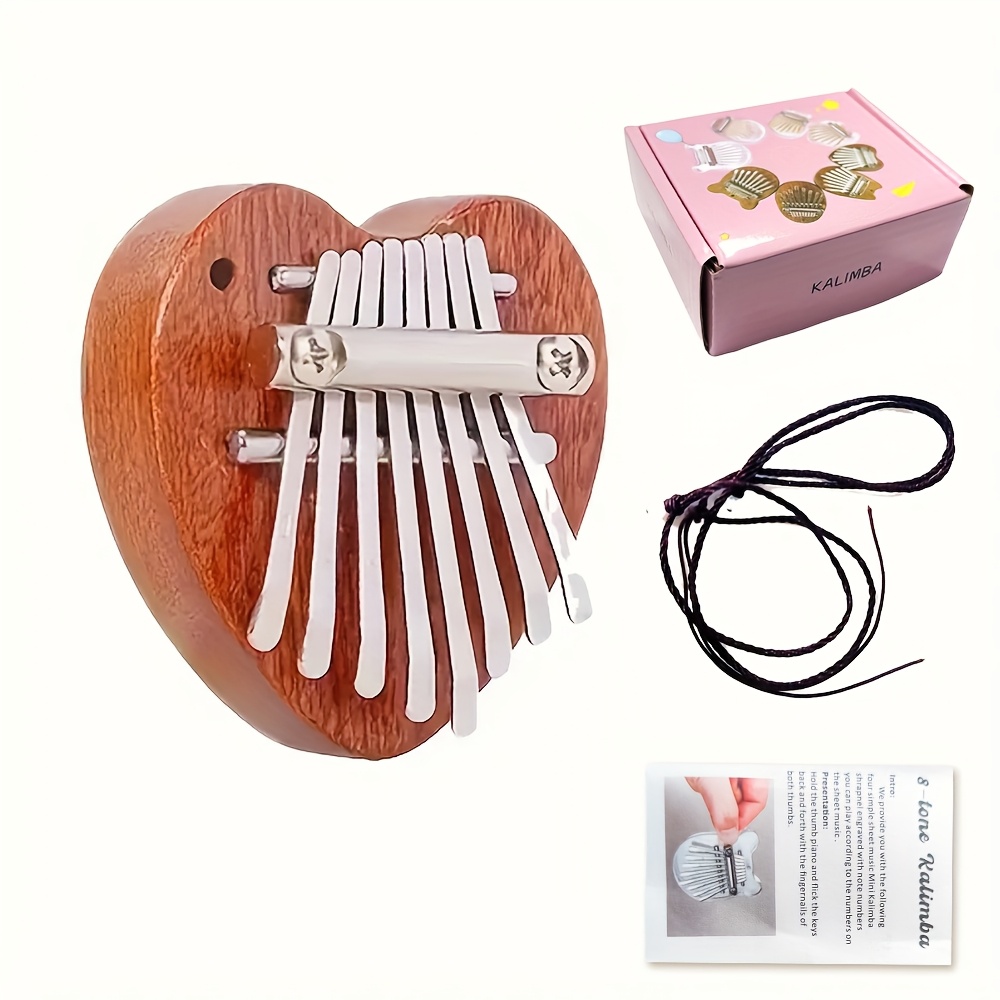A Musical Instrument With Keys - Mini piano kalimba de madeira com