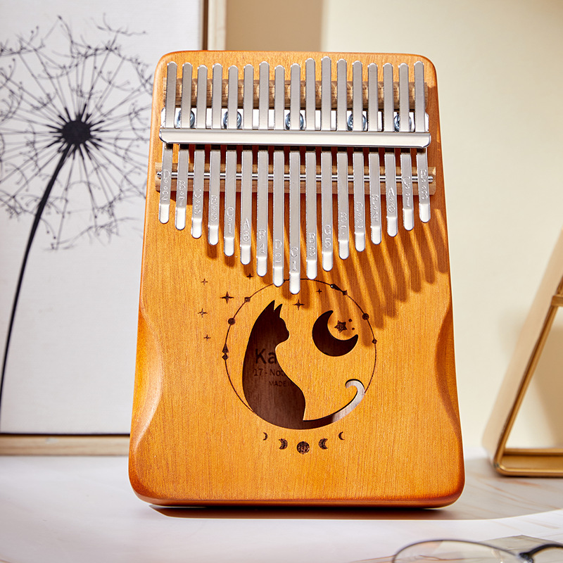A Musical Instrument With Keys - 17 teclas kalimba cor gradiente design